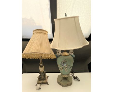 A brass and onyx table lamp with shade together with a pottery table lamp with shade on metal base surmounted by two mermaids