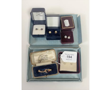 A Victorian 9ct gold garnet set brooch, dress ring, and five pairs of earrings