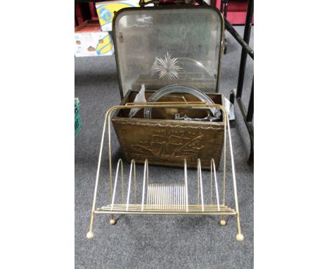 A brass framed etched mirrored fire screen together with a brass embossed magazine rack, chrome companion set, mid century wi