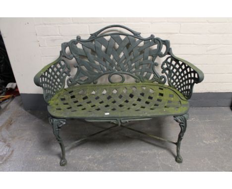 A cast metal Victorian style garden bench