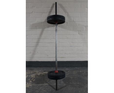 A weights bench together with four DP 10kg plate weights 