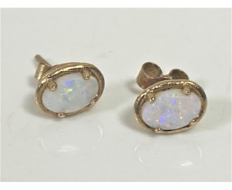 A pair of 9ct gold opal stud earrings