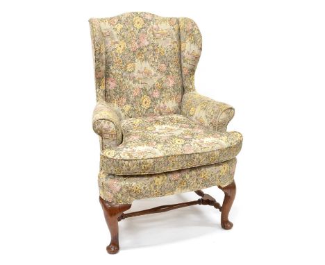 George III Upholstered Wing Back Armchair George III mahogany wing back armchair, upholstered in tapestry fabric, raised on c