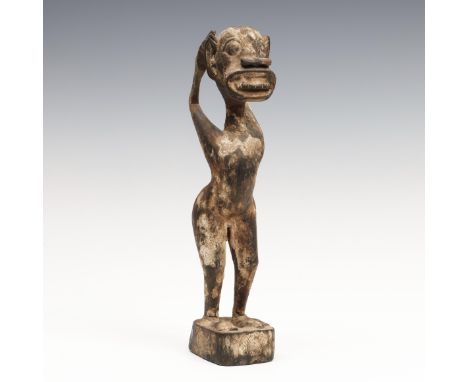 Bali, Sebatu, a standing demon figure, ca. 1920. h. 29,5 cm. Published: Cultureel Indie, Jan Poortenaar, derde jaargang, 1941