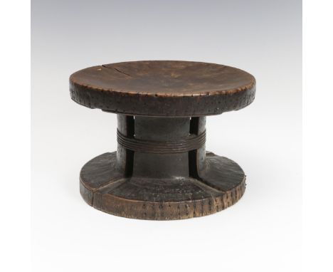 D. R. Congo, Mangbetu, a drum shaped stool, the outer rims set with iron nails. diam. 22,5 and H. 14 cm. [1]