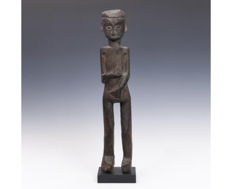 East Kalimantan, Dayak, a light wood standing male figure. h. 59,5 cm. Provenance: Frans Faber, Amsterdam and private Dutch c