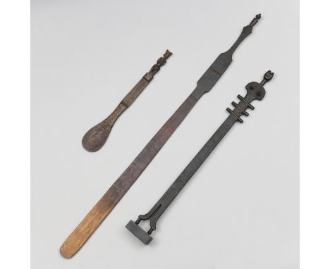 Tanzania, two wooden spatula, the long item with a mwani hiti top, the other topped by a female; herewith a neck of a string 