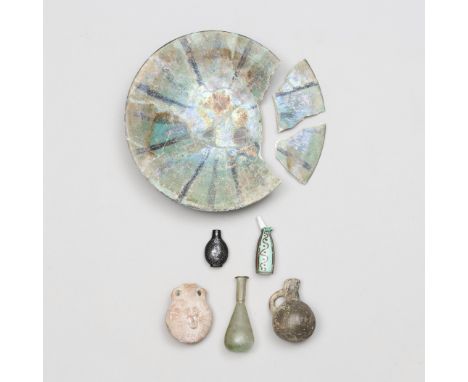 A collection of four antique objects: A Roman glass flask, a terracotta miniatur amphora, ca. 2nd century AD, Persia, a terra