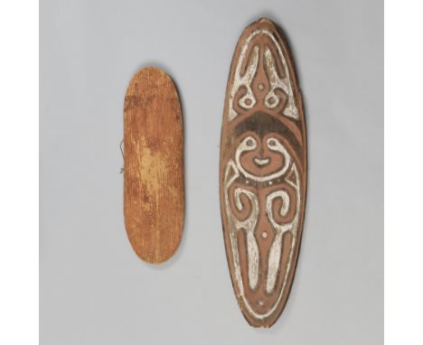 P.N. Guinea, Papua Golf, spirit board, gope and Aboriginal, a wooden shield, L. 88 and 55 cm. [2]