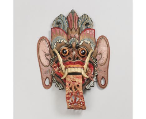 Bali, a polychrome demon mask. L. 40 cm.