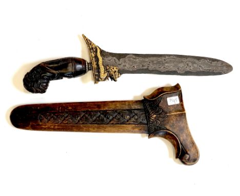 Bali, a straight kris with handle in shape of Rakshasa figure and a Naga figure the blade depicting a Naga figure with accent