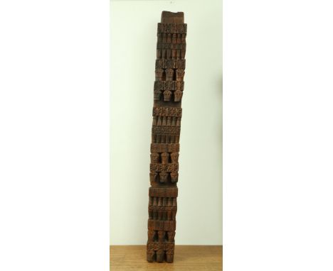 Nuristan, a carved wooden architectural pilar, 1st half 20th century. decorated with anthropomorphic heads and geometrical de