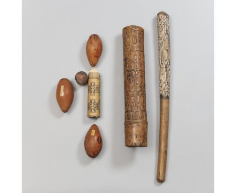 An assorted collection of New Guinea objects; consisting of three gourd penis covers, Hollandia; Asmat bamboo horn, fu; Lake 