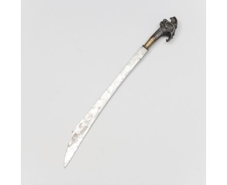 Nias, a sword, balato, with an elaborately carved hilt, (scabbard missing). L. 68,3 cm. [1]