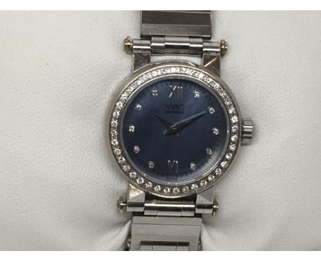 A ladies Movado Vizio Watch with diamond bezel and a diamond dial on a blue face, stainless steel strap.(Â£15 U.K. shipping)