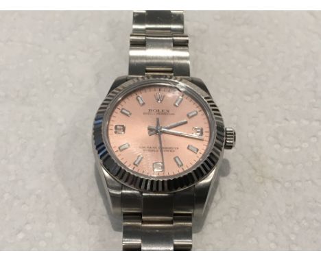 A quality Rolex Oyster midi steel Superlative Chronometer watch with 18ct white gold bezel. Pink dial, model and serial numbe