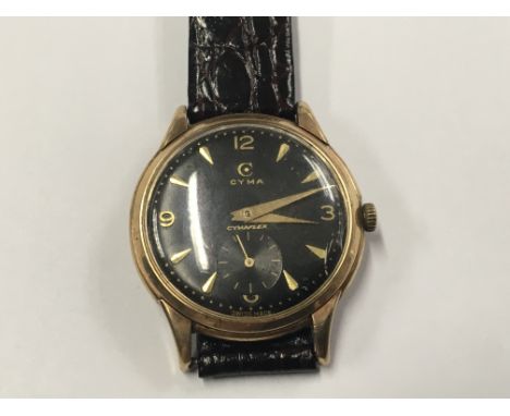 A Gents Vintage 9ct Gold CYMA Swiss made Watch. Manual wind original black dial in working order. Postage to the U.K. is £15.