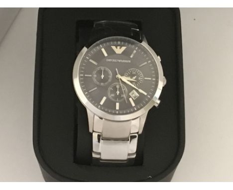 A Gents Armani Chronograph watch with its high shine-stainless steel and a deep blue face, comes complete with box. Full work