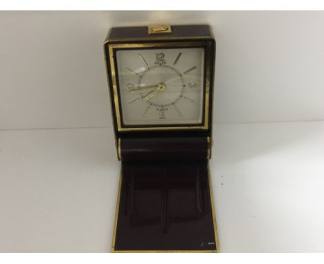 A Vintage Jaeger traveling clock with illuminated hands. 8 day going mechanical movement. Postage to the U.K. is £15.
