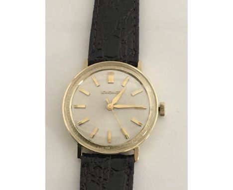 A Vintage Gents Longines 14ct Gold cased Watch with raised battons in working order and in good condition. Postage to the U.K