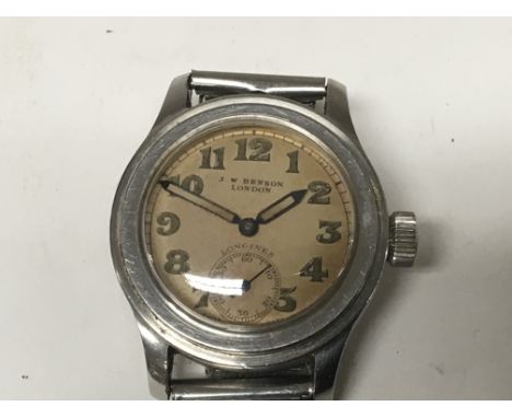 A Vintage Gents or Midi. Longines Watch, manual wind, Stainless Steel cased. The original dial with  J W Benson London the re