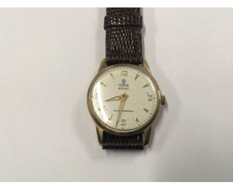 A 9ct Gold Tudor Royal Manual wind Gents Watch with a white dial in working order. Postage to the U.K. is £15.