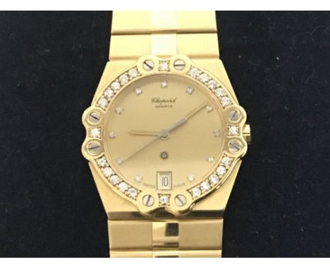 A Quality Chopard Midi Watch 18ct Gold case and bracelet with a diamond set bezel, the dial with subtle but elegant  diamond 