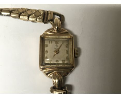 A ladies Vintage Gold Tudor Watch of Art Deco design with a replacement strap. Working order. Postage to the U.K. is £15. 