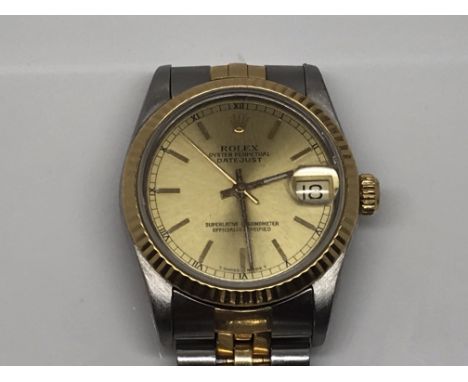 A ladys Midi Rolex DateJust Superlative Chronometer steel and gold bi metal case and strap champagne dial model number 68273 