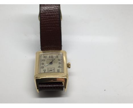 A 1930s 18 ct Jaeger Lecoultre reverso the square dial with Arabic numerals and second subsidiary dial with a applied leather