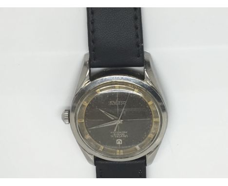 A Vintage Gents, Universal Geneve Polerouter, Automatic Microtor,Black dial Crome cased and working order.Uk Shipping £15