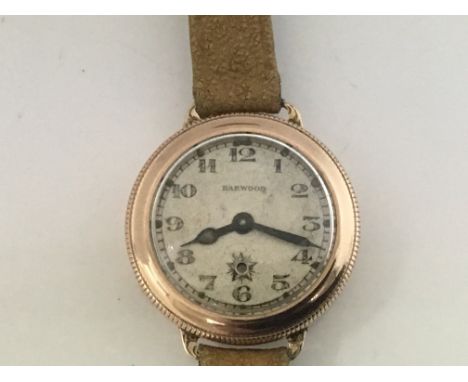 A Rare 1920s Harwood 9ct Gold cased Watch.The first Automatic wrist watch, with an outer swivel bezel hand adjustment, the di
