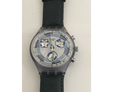 A designer Swatch Watch with a purple and pale blue dial second subsidiary dials working order visible mechanism. Postage to 