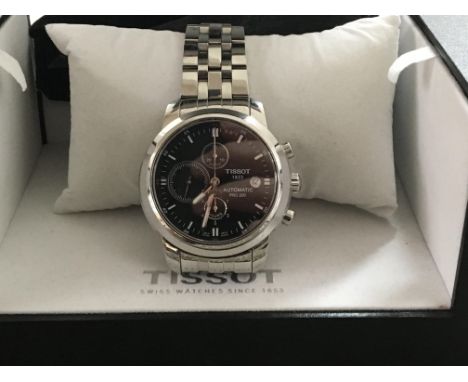 A Tissot prc 200 automatic chronograph with steel bracelet fitted in original box. Postage to the U.K. is £15.