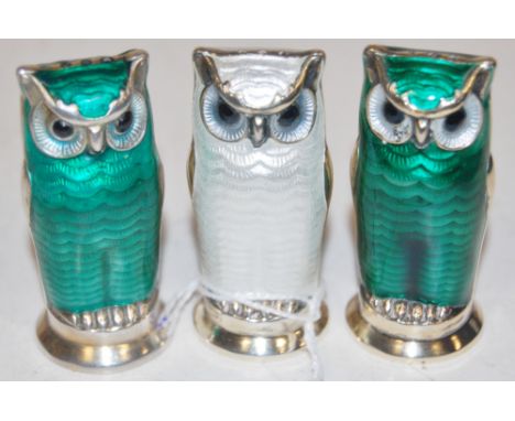 A set of three David Andersen of Norway sterling silver and enamel novelty table pepperettes in the form of owls  Condition R