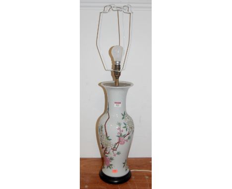 A 20th century stoneware vase of trumpet form, decorated with birds and flowers, converted into a table lamp 