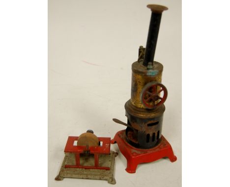 A mid-20th century tinplate stationary engine and matching grindstone (2) 