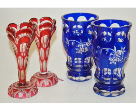 A pair of Bohemian ruby overlay glass specimen vases and a pair of blue overlay glass vases (2) 