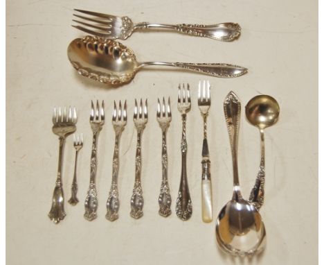 Assorted plated fork and spoons to include sauce ladle, salad servers, etc