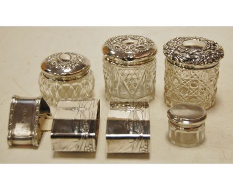 Silver and white metal wares to include napkin rings, dressing table tidies, etc