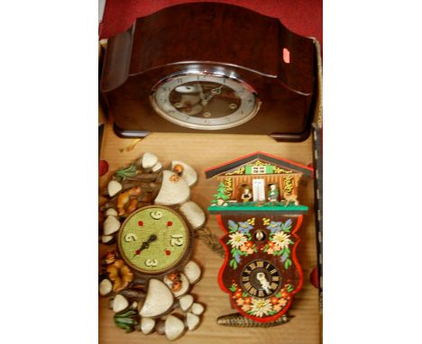 An Art Deco bakelite cased mantel clock together with two novelty wall clocks