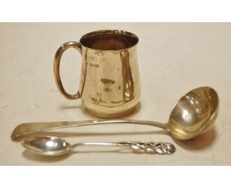 A silver small christening mug, late Georgian sauce ladle, and a continental white metal teaspoon (3) Condition Report / Extr