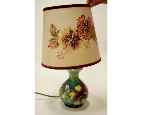 A Moorcroft pottery table lamp in the Anemone pattern with original Moorcroft shade, with paper label verso