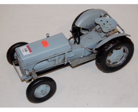 A tinplate model of a Ferguson tractor 