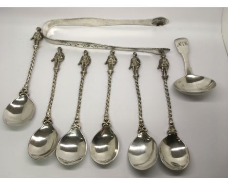 A collection of silver comprising six crusader spoons a pair of Georgian sugar tongs and a Georgian caddy spoon