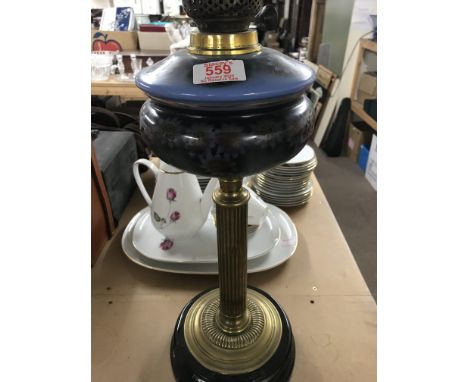 A oil lamp with brass column 