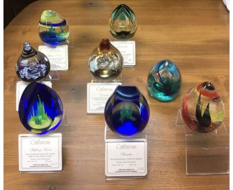 A group of boxed Caithness paperweights