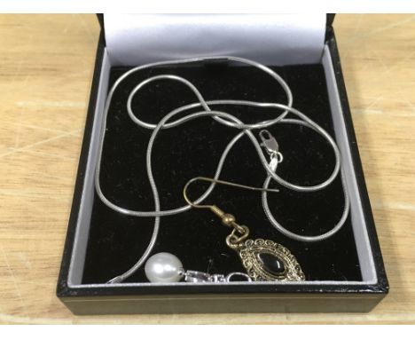 A 14ct white gold pendant, 9ct white gold chain and a yellow metal earring (3). PLEASE NOTE: This is a 9ct white gold chain, 