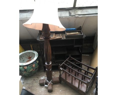 A carved wood lamp stand and a canterbury