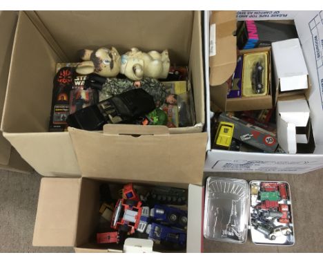 A collection of toys in two boxes including die cast vehicles, two Star Wars figures, Action Man and others.